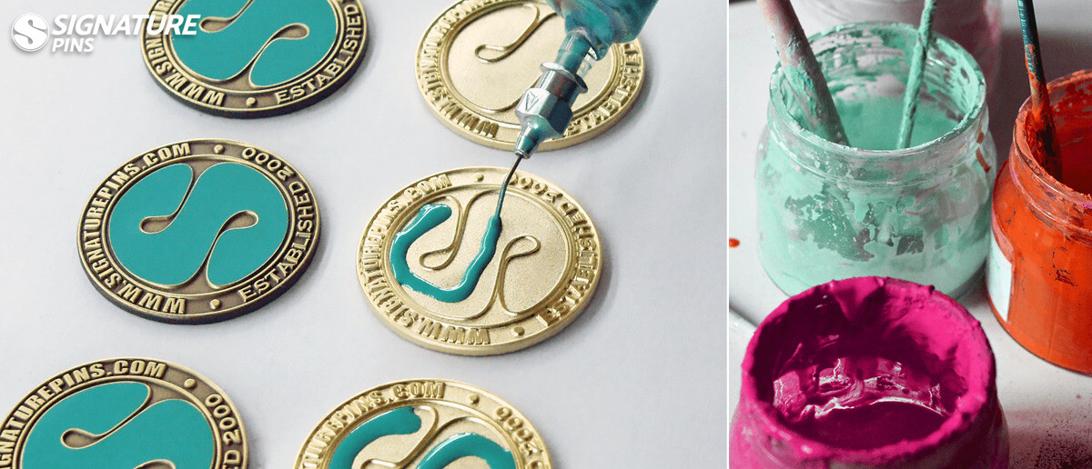 Close-up of finished custom enamel pins showing the glossy enamel finish over die-struck metal artwork