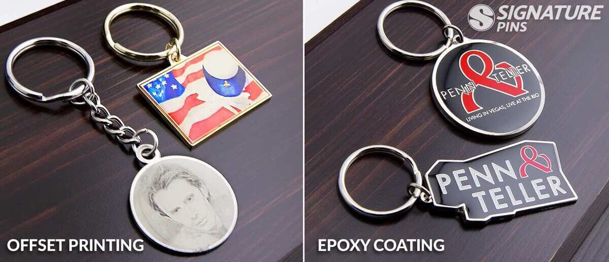 Offset printed keychains with portrait and patriotic art next to epoxy coated Penn and Teller Vegas keychains