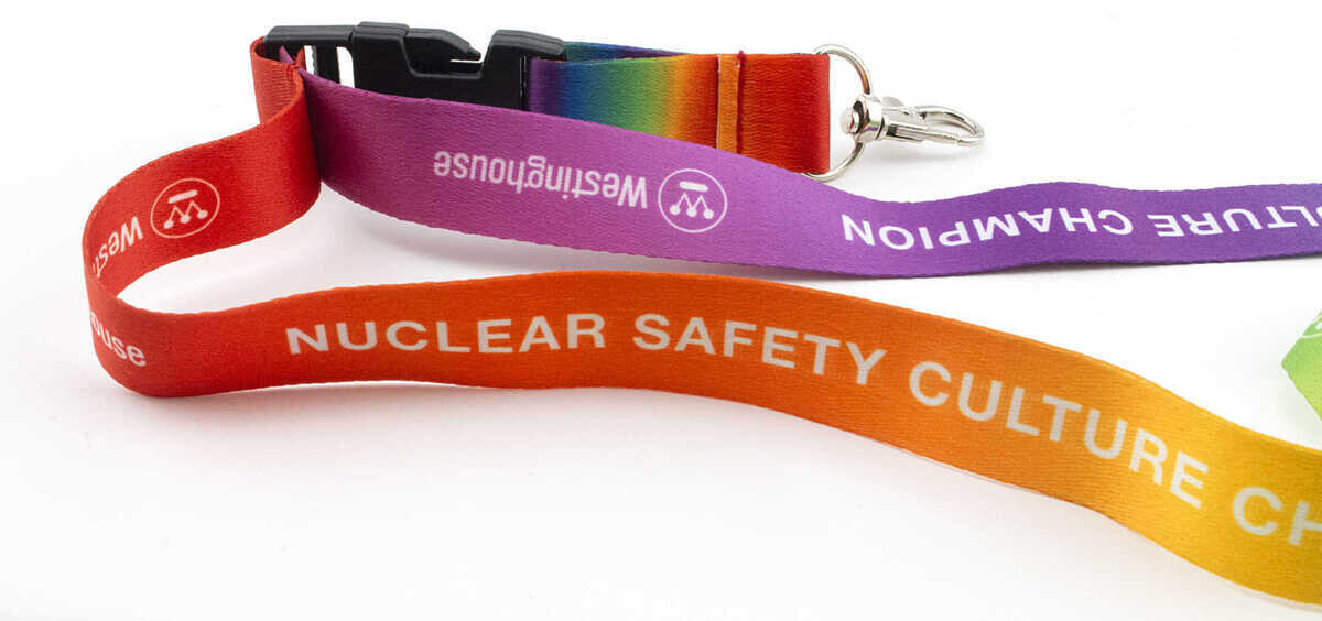 Sublimated lanyards with full-color printing showing Westinghouse Nuclear Safety Culture Champion designs in rainbow gradient