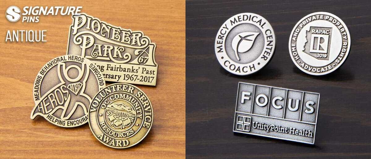Antique finish die struck pins including Pioneer Park anniversary and medical center designs