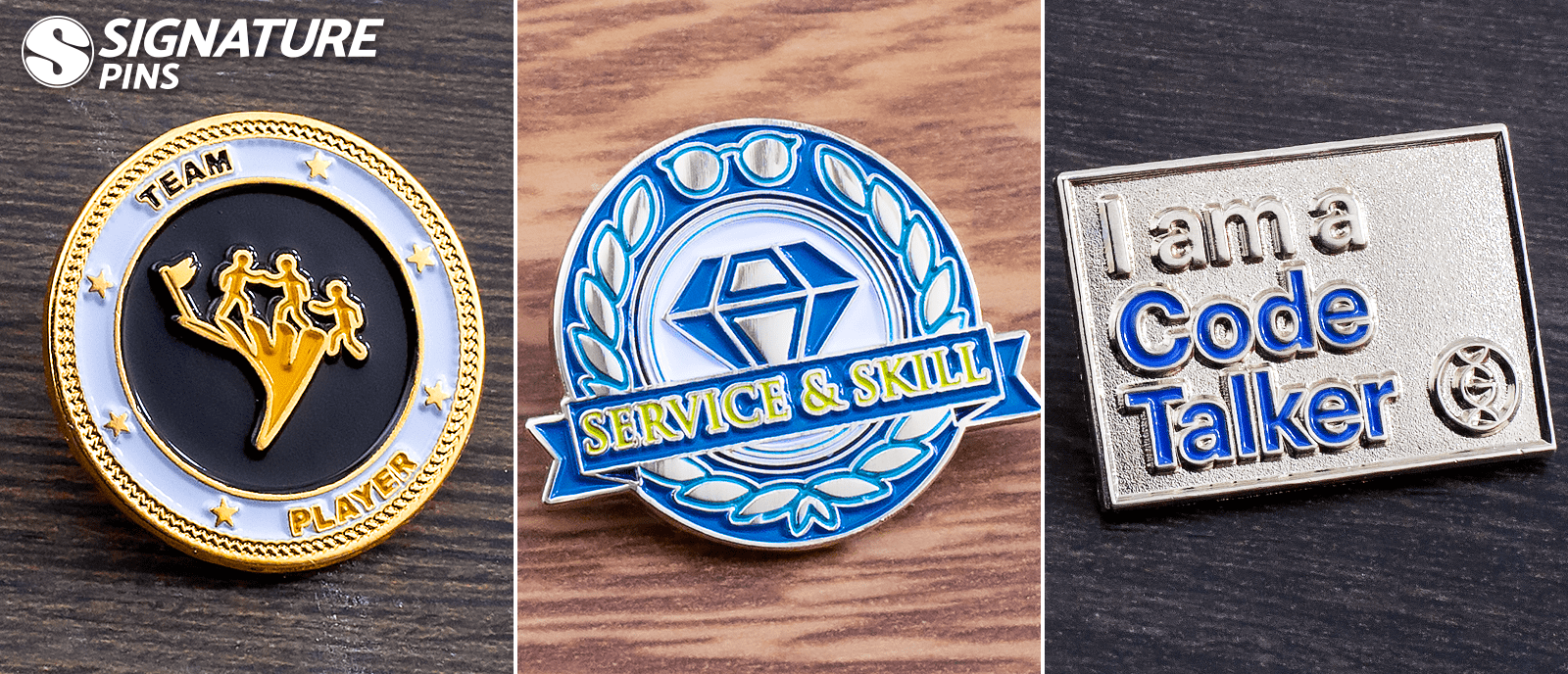 Employee recognition pins featuring Team Player award with figures and stars, blue Service & Skill diamond pin, and silver I am a Code Talker pin
