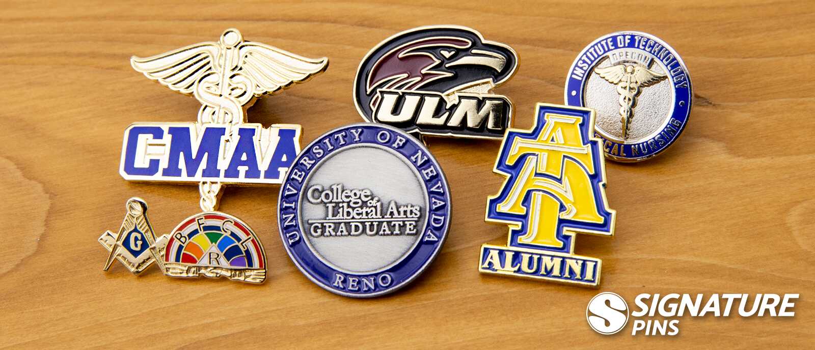 Three pin styles compared: purple Hononegah Excellence soft enamel, green Benjamin Franklin High School cloisonné, and silver Pi Delta Sigma die struck fraternity pin