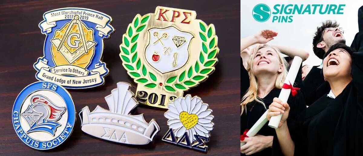 Collection of university graduation pins including CMAA with caduceus, ULM hawk mascot, University of Nevada Reno Liberal Arts, and North Carolina A&T Alumni pins