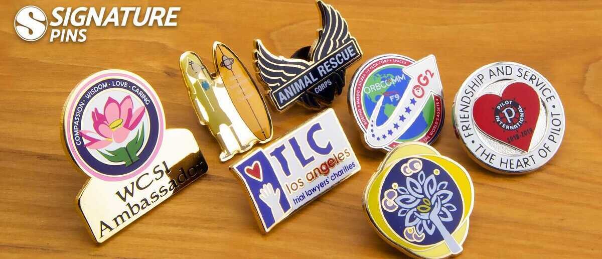 Silkscreen pins including flower ambassador, space shuttle, TLC Los Angeles, and Pilot International designs