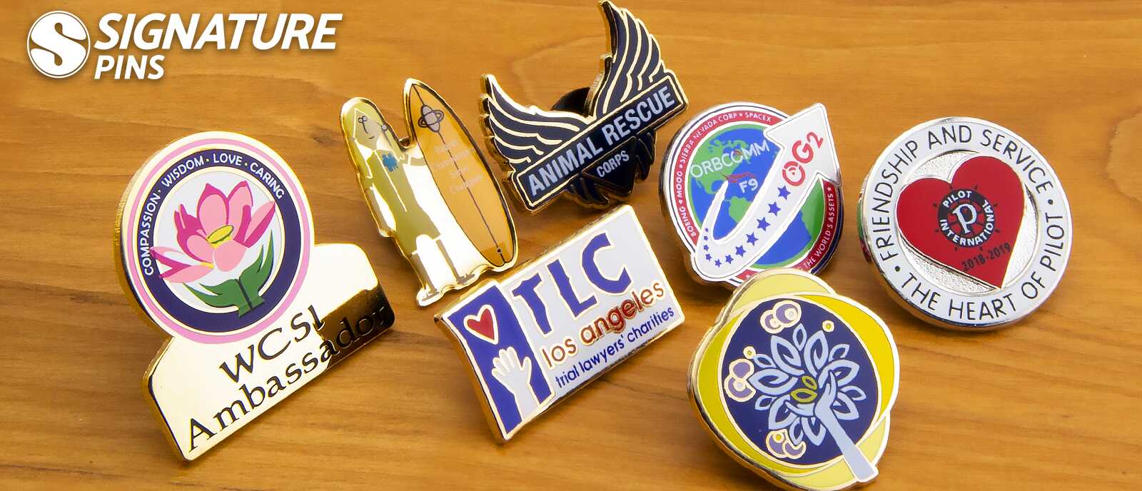 Silkscreen pins including flower ambassador, space shuttle, TLC Los Angeles, and Pilot International designs
