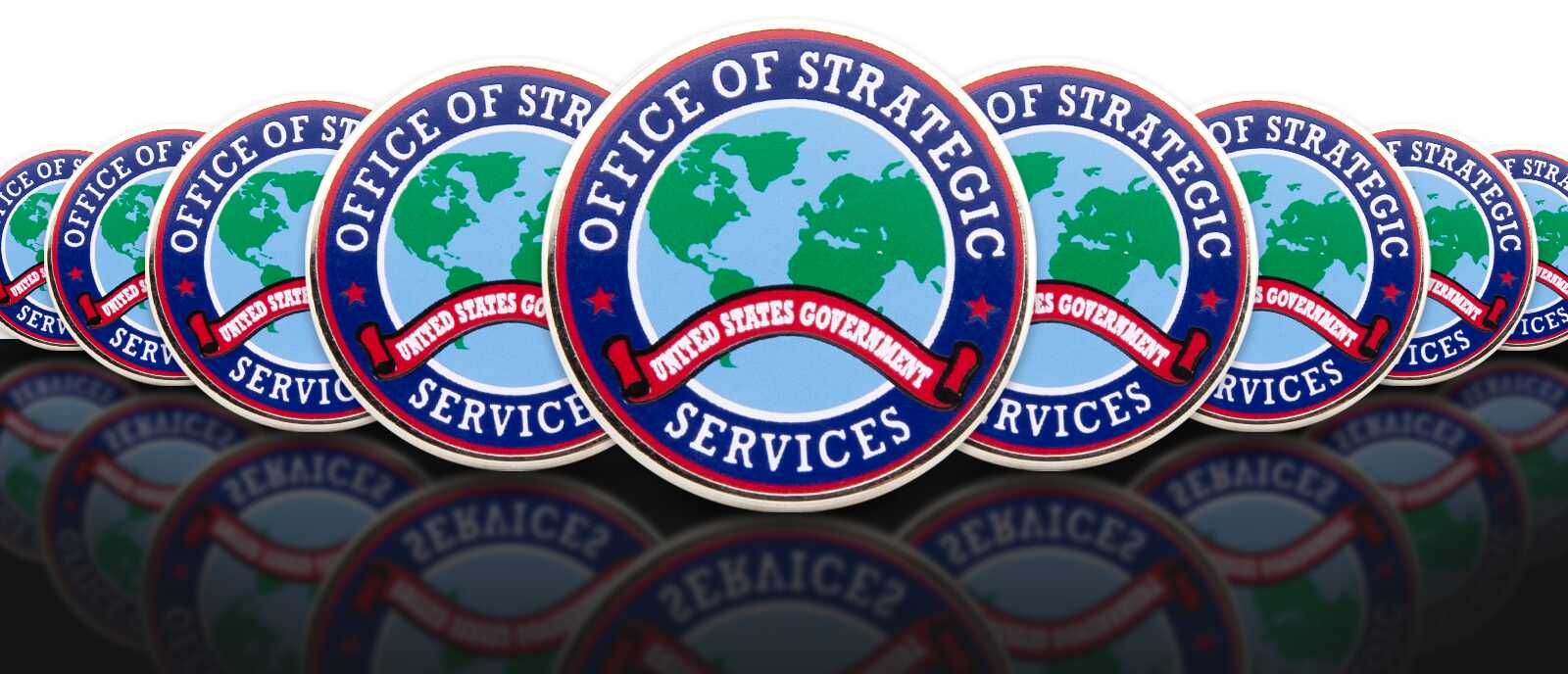 Bulk order of round Office of Strategic Services enamel pins featuring globe design and United States Government banner