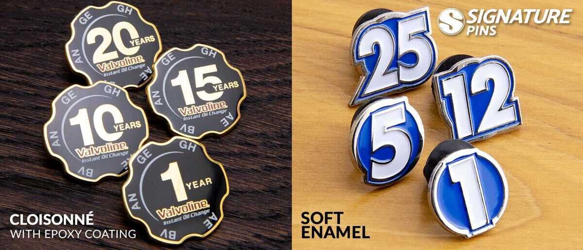 Comparison of cloisonné Valvoline years of service pins in black and gold versus blue and white soft enamel number pins